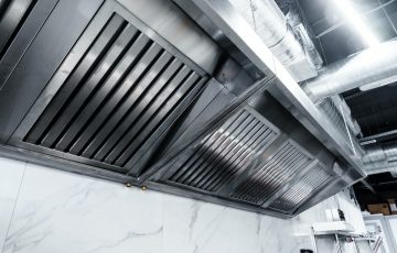 New clean stainless steel hood in professional kitchen
